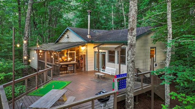 back of house with a wooden deck