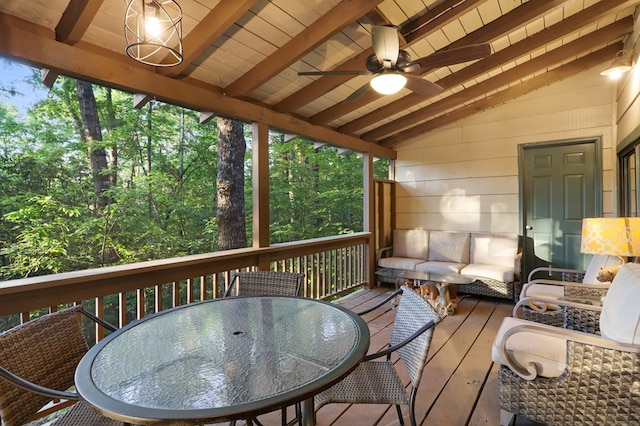 wooden terrace featuring an outdoor living space and ceiling fan