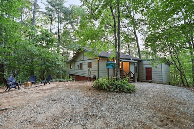 view of front of home featuring an outdoor fire pit