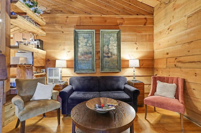 sitting room with hardwood / wood-style flooring and wood ceiling