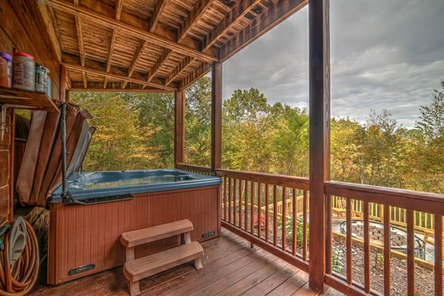 wooden terrace with a hot tub