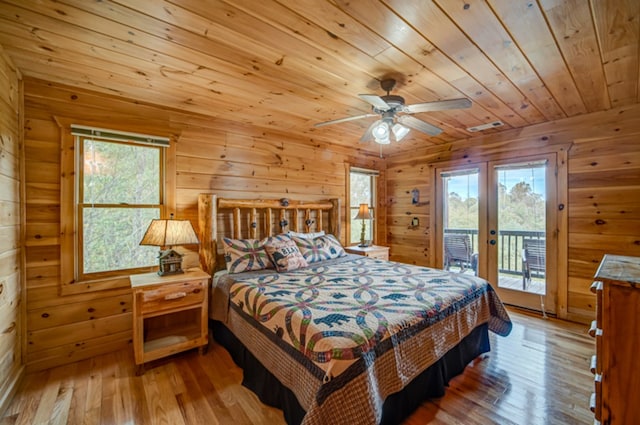 bedroom featuring wooden ceiling, light hardwood / wood-style flooring, access to outside, and ceiling fan