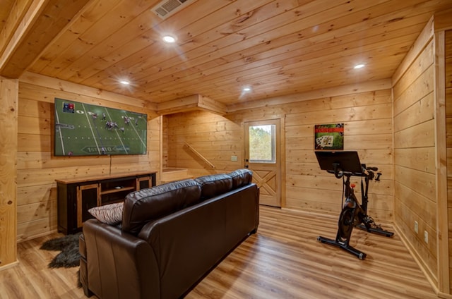 interior space with wood ceiling, wooden walls, and light hardwood / wood-style floors