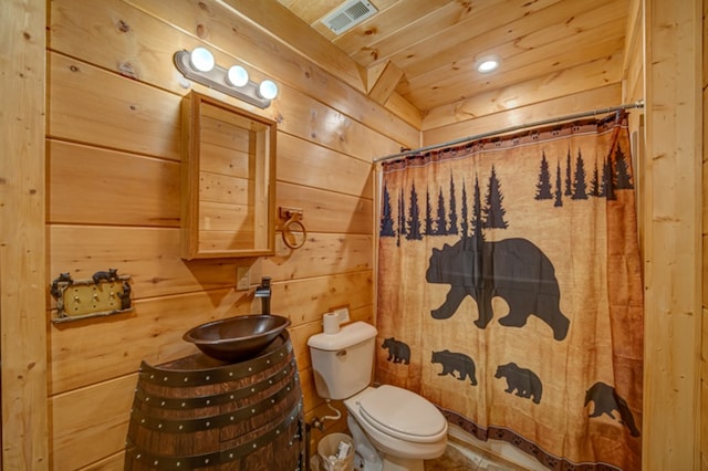 bathroom featuring wooden ceiling, toilet, walk in shower, and wooden walls