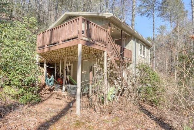 view of home's exterior with a wooden deck