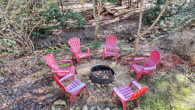 view of yard with an outdoor fire pit