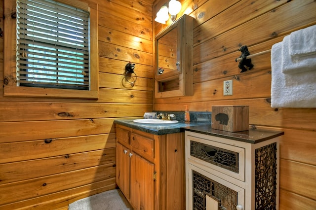 bathroom with wooden walls and vanity