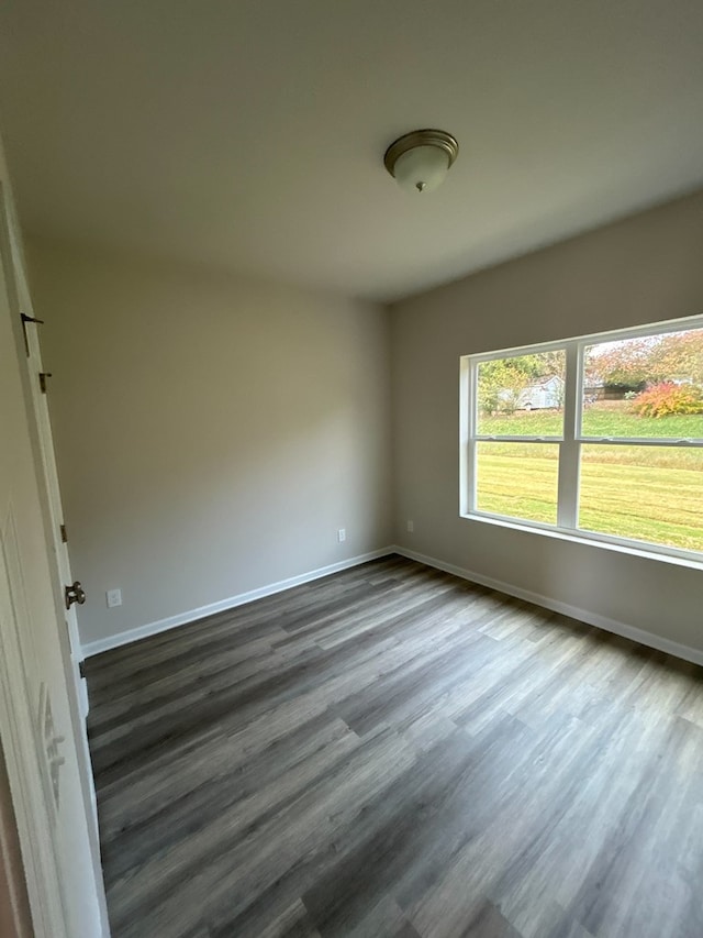 unfurnished room with hardwood / wood-style flooring