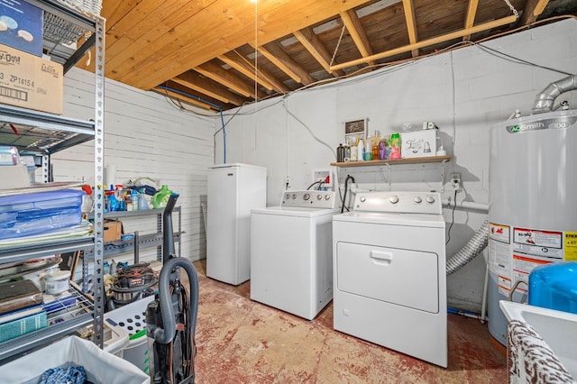 laundry area featuring water heater and independent washer and dryer