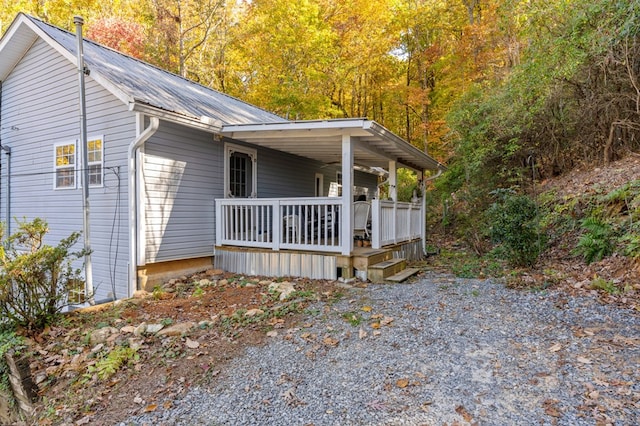 view of side of home featuring a wooden deck