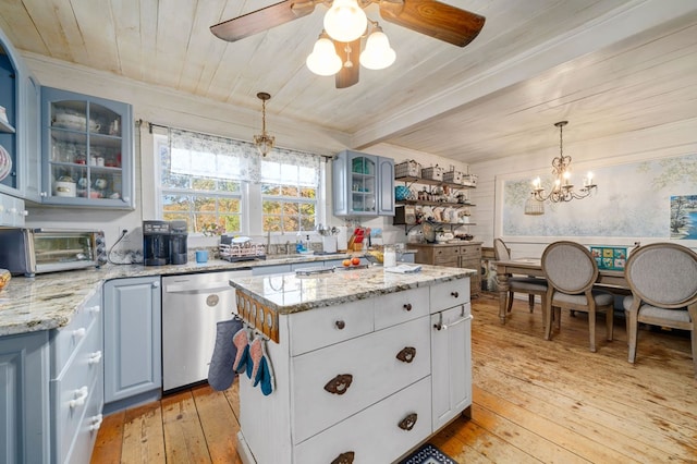 kitchen with a kitchen island, pendant lighting, dishwasher, and light hardwood / wood-style flooring