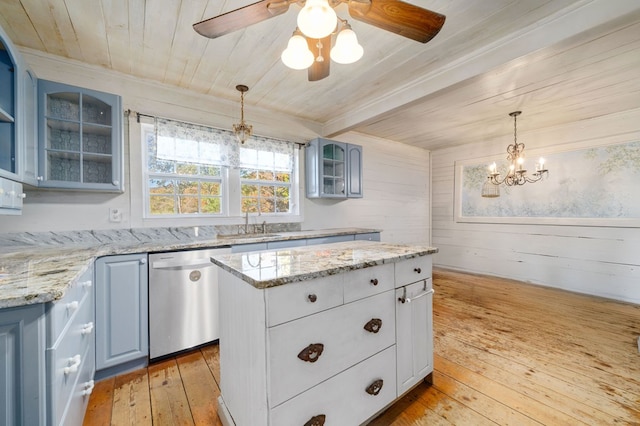 kitchen with wood ceiling, dishwasher, wooden walls, a kitchen island, and light hardwood / wood-style flooring