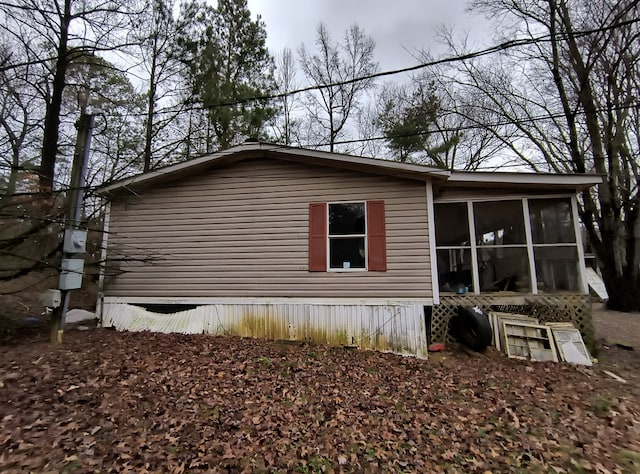 view of home's exterior featuring a sunroom