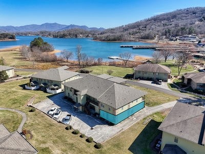 drone / aerial view with a water and mountain view