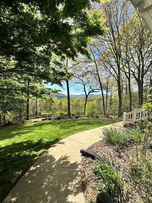 surrounding community featuring a yard