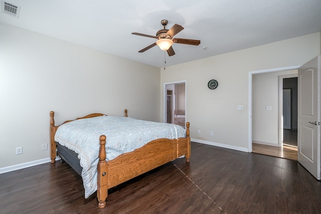 bedroom with ceiling fan and dark hardwood / wood-style flooring