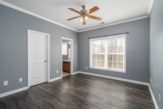 empty room featuring dark wood-type flooring, ceiling fan, and ornamental molding