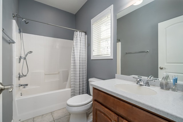 full bathroom featuring shower / bath combination with curtain, vanity, tile patterned floors, and toilet