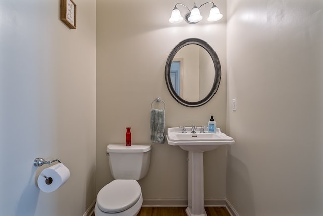 bathroom featuring sink and toilet