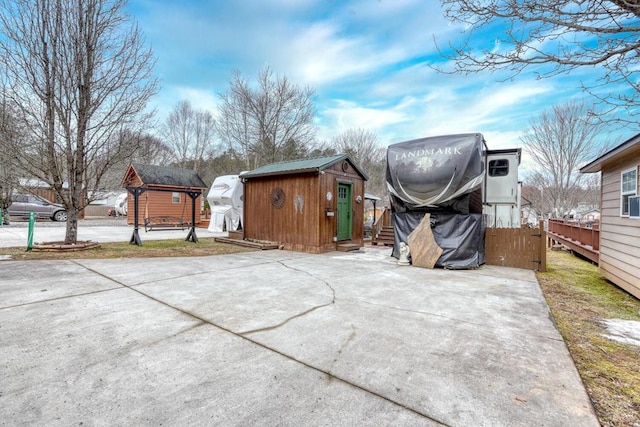 exterior space with a shed