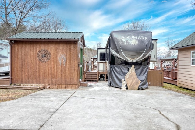 exterior space featuring a patio and a storage unit