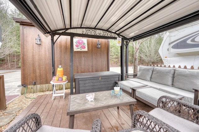 wooden deck featuring outdoor lounge area