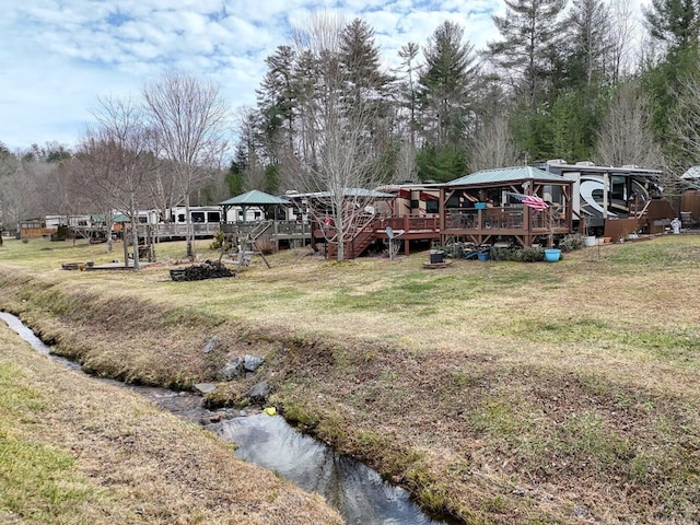 view of yard featuring a gazebo and a deck