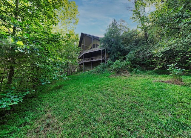 view of yard featuring a sunroom