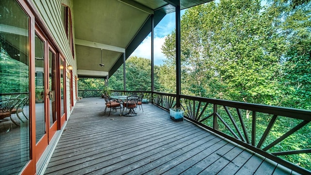 wooden deck featuring outdoor dining area