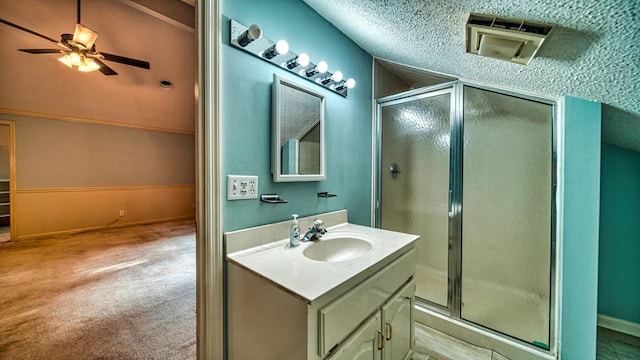 full bathroom featuring a stall shower, baseboards, a ceiling fan, and vanity