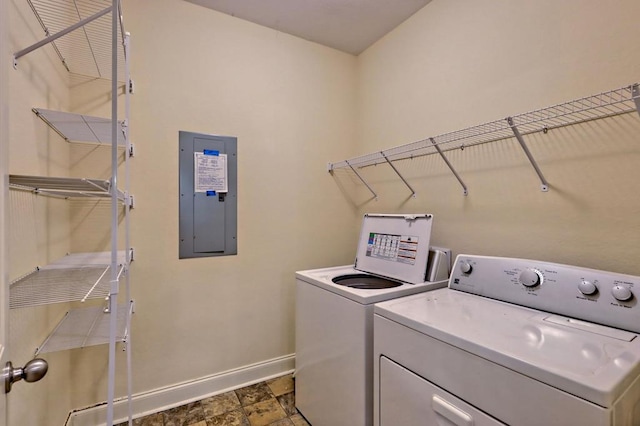 clothes washing area featuring separate washer and dryer and electric panel