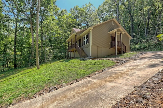 view of side of property with a yard