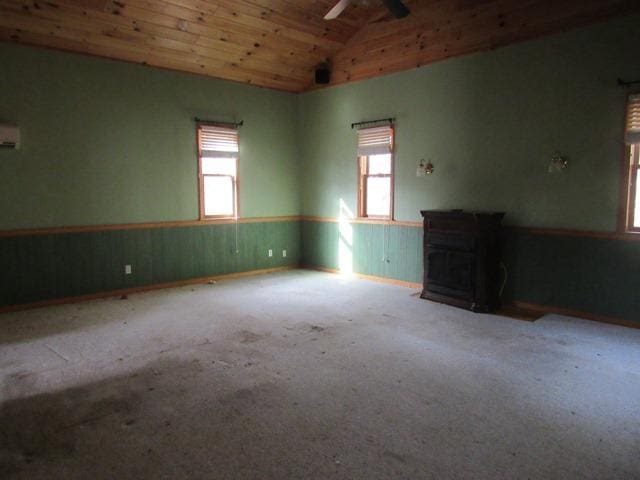 carpeted spare room with wooden ceiling, lofted ceiling, and ceiling fan