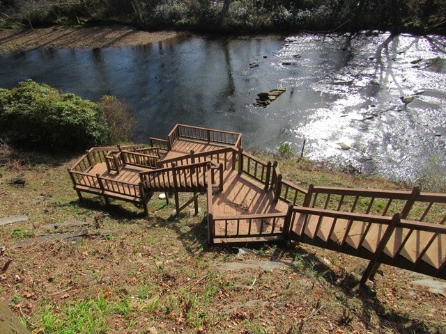 surrounding community featuring a water view