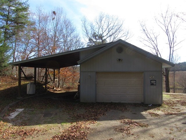 garage featuring a carport