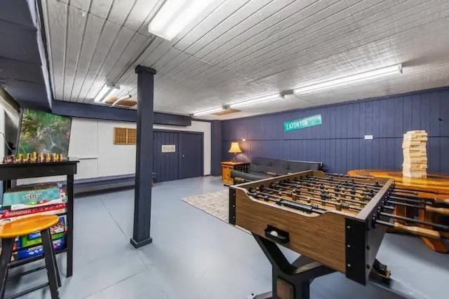 rec room featuring concrete floors