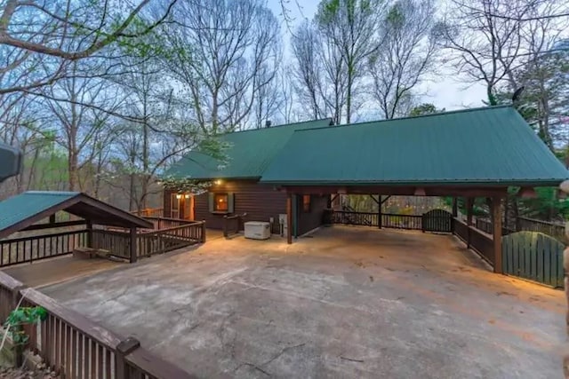 exterior space with a carport