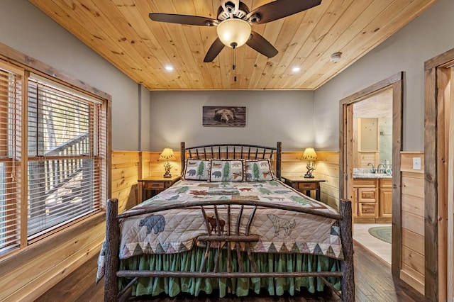 bedroom with recessed lighting, dark wood-type flooring, wainscoting, wooden walls, and wooden ceiling