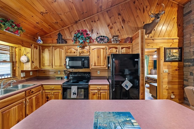 kitchen featuring wooden ceiling, a sink, vaulted ceiling, brown cabinets, and black appliances