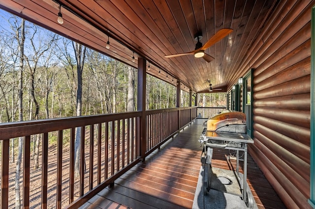 wooden terrace featuring ceiling fan