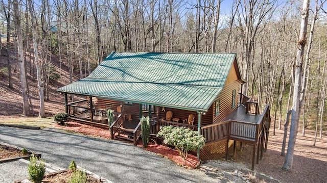 view of front facade with covered porch and metal roof