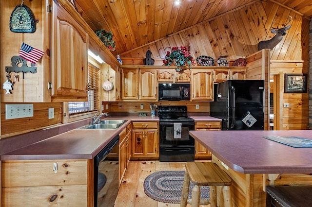 kitchen featuring wooden walls, wood ceiling, vaulted ceiling, black appliances, and a sink