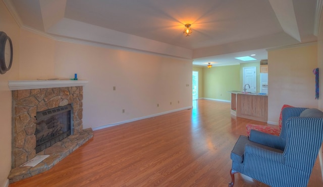 467 Greenlawn Cemetary Rd, Murphy, NC 28906 - living room with a raised ceiling, a fireplace, wood finished floors, and baseboards