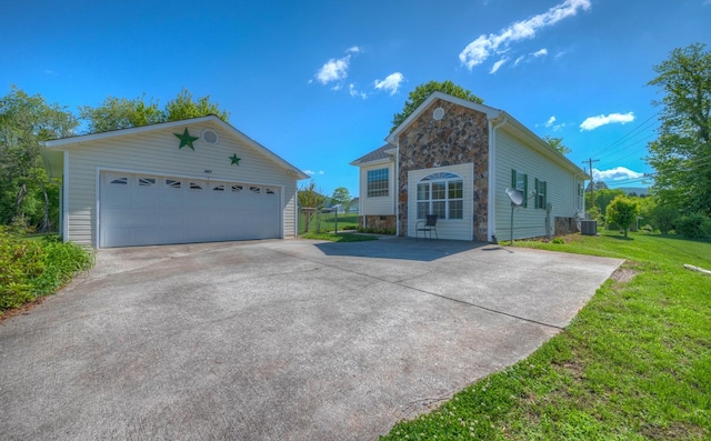 467 Greenlawn Cemetary Rd, Murphy, NC 28906 - view of front of property featuring stone siding, an outdoor structure, central AC unit, a detached garage, and a front lawn