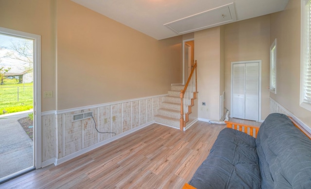 467 Greenlawn Cemetary Rd, Murphy, NC 28906 - unfurnished living room with attic access, wood finished floors, a wainscoted wall, and baseboards