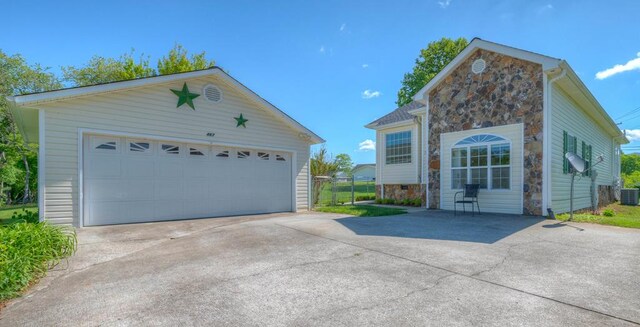 467 Greenlawn Cemetary Rd, Murphy, NC 28906 - view of front of property with stone siding, an outdoor structure, a garage, and central AC unit