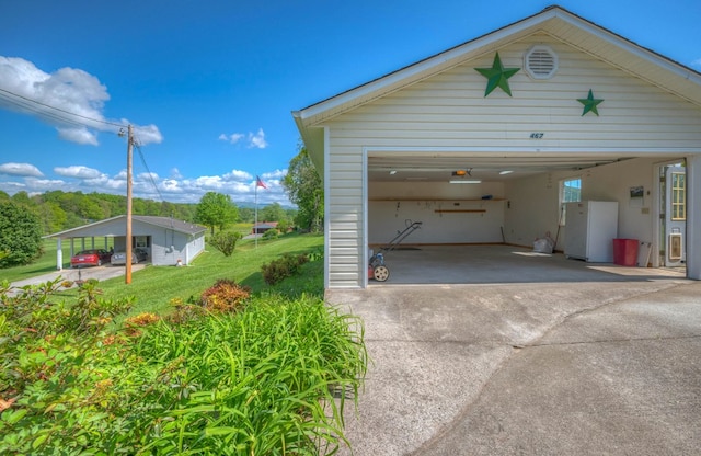 467 Greenlawn Cemetary Rd, Murphy, NC 28906 - garage with freestanding refrigerator and concrete driveway