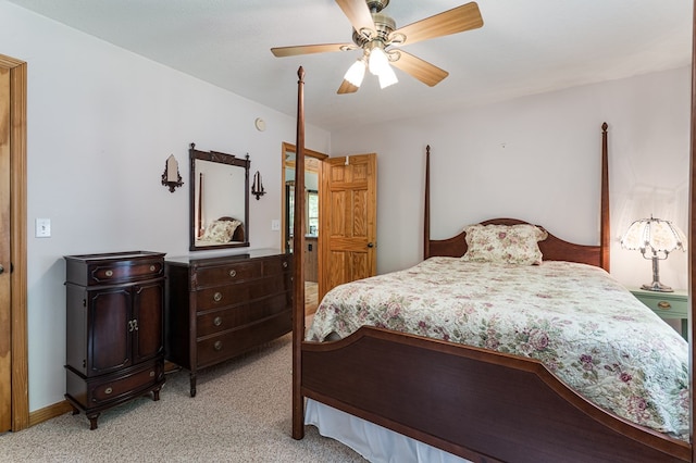 bedroom featuring light colored carpet and ceiling fan
