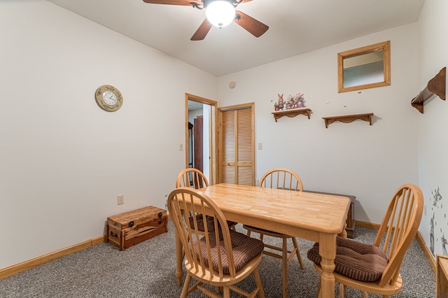dining room featuring carpet floors, a ceiling fan, and baseboards