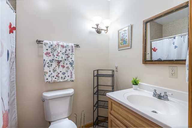 bathroom with vanity, toilet, and a shower with shower curtain